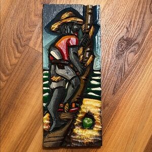 Vintage hand-carved and painted wooden folk art panels from Brazil.